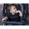 mockup of a baby boy wearing a round neck tshirt template while on his stroller a16089