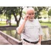 senior man out by the pond wearing a round neck tee mockup b12384