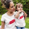 mockup of a mom and her baby girl wearing different round neck tees mockup while outdoors a16075