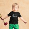 t shirt mockup of a baby boy holding a soccer trophy 43079 r el2