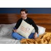 squared pillow mockup featuring a man sitting over a bed 29023