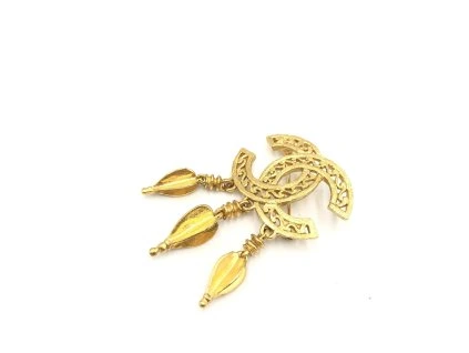 Zlatá brož s logem CC