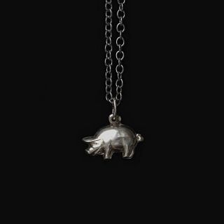 teeny tiny 7 mm pig made of solid silver! careful, side effects of wearing it every day include a surge of luck.🍀 i found...