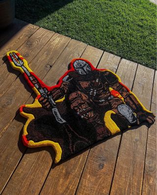 @estilo.rugz showcasing an epic Mandalorian-inspired tufted rug that brings Star Wars energy straight into your space ⚔️🚀...