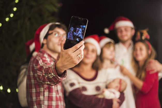 friends-making-selfie-christmas-party_23-2147969531