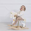 PL134 toddller laughing on unicorn carousel rocking horse