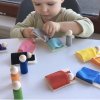 Montessori-Holzspielzeug "Small Peg Dolls with Hats, Beds and Balls"