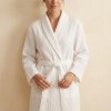 woman wearing white waffle bathrobe, wjth the background of creamy wall @White waffle bathrobe (1)