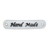 Hand Made, oválná koženková cedulka stříbrná 12x45 mm