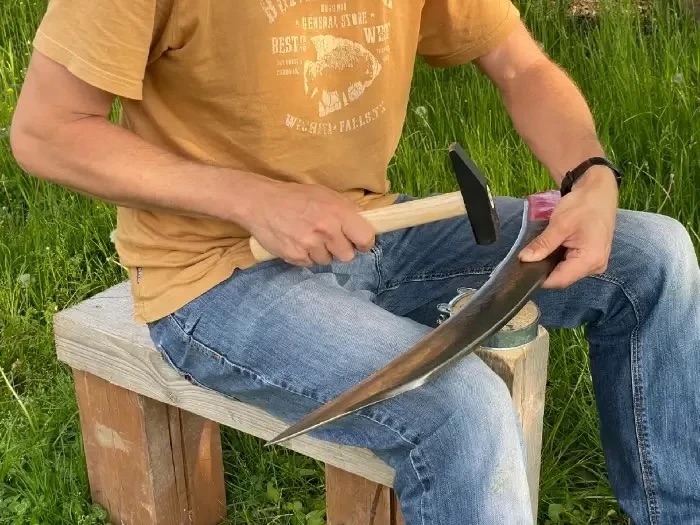 Peening (hammering) of scythe