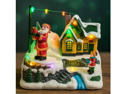 Vianočná dedinka so svietiacim domčekom a otáčajúcim sa Santom