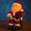 Santa Claus s husľami na hojdacom kresle – svieti, hýbe sa a hrá hudbu (23 cm)