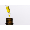 macro closeup pipette with hemp oil medicinal extract oil bottle