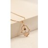 gold hamsa with black diamond