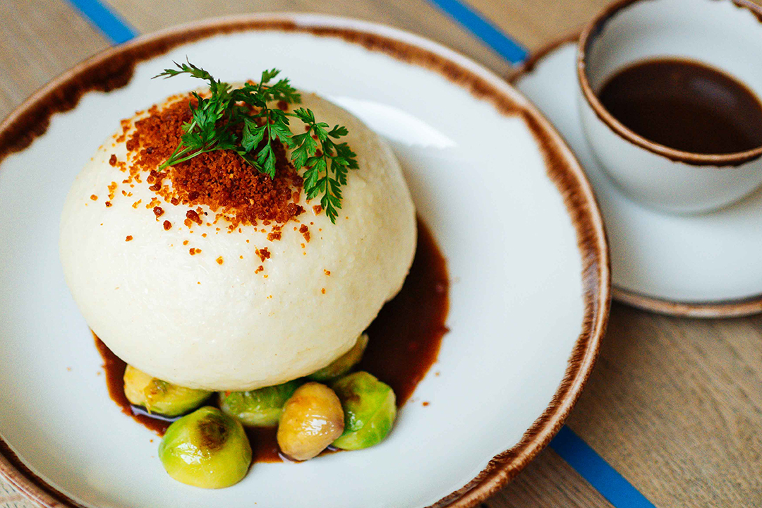 Sourdough dumpling, a different chef's specialty each time, to be enjoyed on the first Wednesday of every month and the six following days. This is the Prague sourdough dumpling stuffed with pulled pork neck.