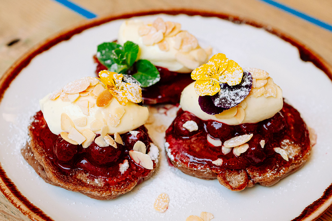 Our Czech desserts are worthy of admiration. These are freshly baked chocolate pancakes with stewed cherries and vanilla cream. 