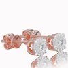 Subtle stud earrings with diamonds in red gold, 14K