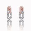 Subtle earrings with white sapphires in mixed gold, 14K