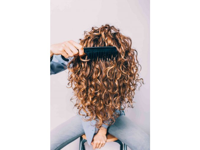 woman combing curly hair getty 1119 2000 e7ba798763064403a38d9b66d5169b49