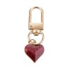 Carabiner with heart pendant