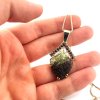 Moldavite pendant in gold with garnet 2000276160000