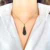 Moldavite pendant in gold with garnet 2000291890005