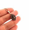 Moldavite pendant in gold with garnet 2000091220002