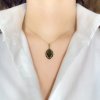 Moldavite pendant in gold with garnet 2000091220002