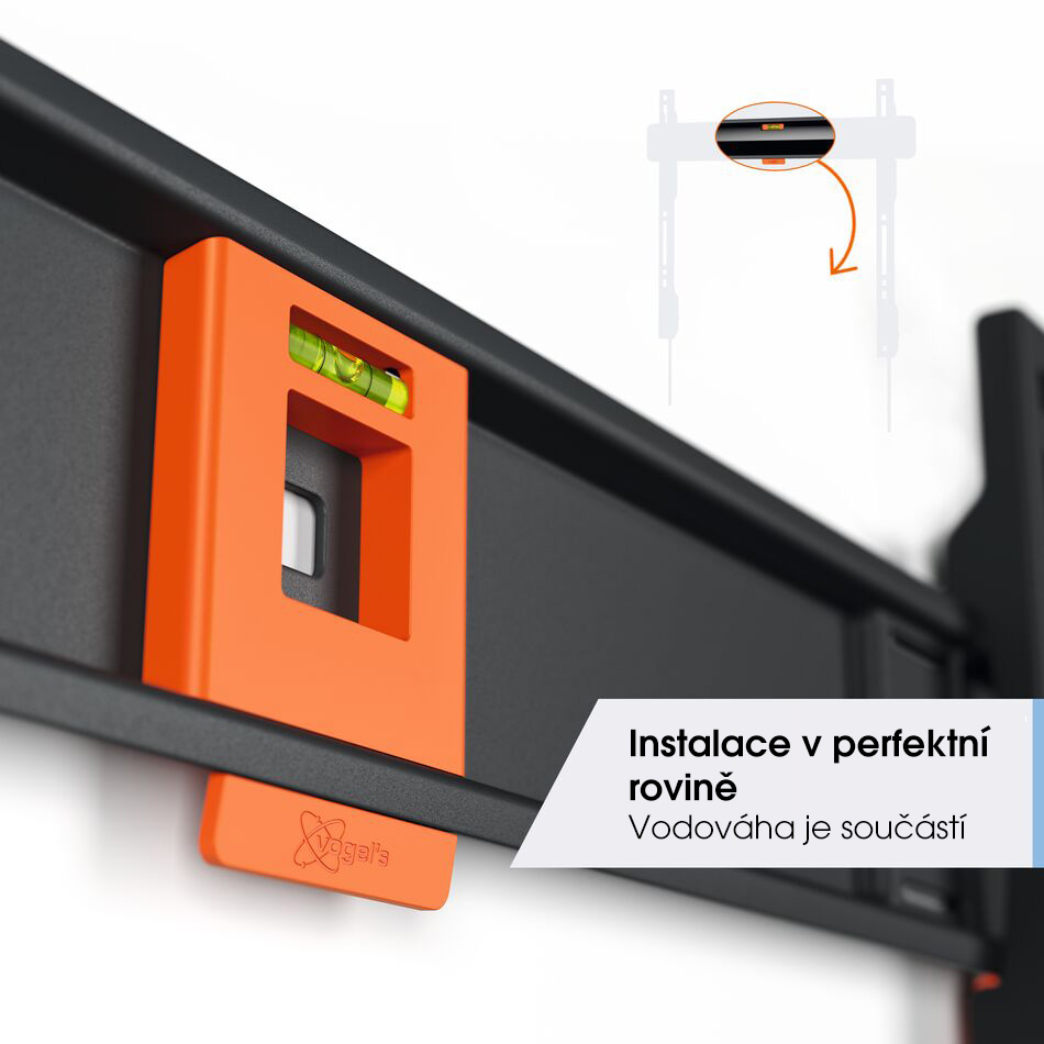 Detail zabudované vodováhy Vogel's TVM 3403 — oranžový prvek s libellou pro přesnou instalaci v rovině