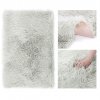 Huňatý světle šedý koberec DOKKA (Rozmer 50 x 150 cm)