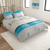 Bavlněné povlečení DELUXE tyrkysové s květinovým vzorem a blokovým designem