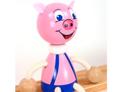 piggy wooden sitting figure