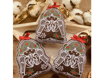 Vyšívané vánoční ozdoby ve tvaru perníčků.Hnědé vyšívané vánoční perníčky.Ozdoba na stromeček nebo dekorace.