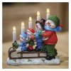 LED svícen – sněhuláci na saních, 24 cm, 2x AA, vnitřní, teplá bílá, časovač
