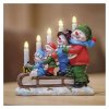 LED svícen – sněhuláci na saních, 24 cm, 2x AA, vnitřní, teplá bílá, časovač