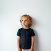 engin1 Mock up young child CUTE boy wearing navy t shirt a roun 25e43f67 8200 49dc b3f1 78cdd8a0b2b2