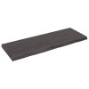 Nástěnná police tmavě hnědá 140x50x(2-6)cm ošetřený masivní dub